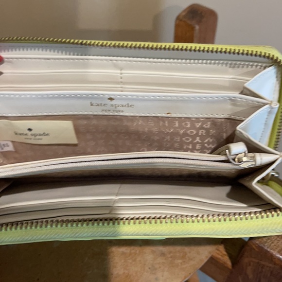 A Beautiful Line green wallet with a few spots. - Picture 2 of 3